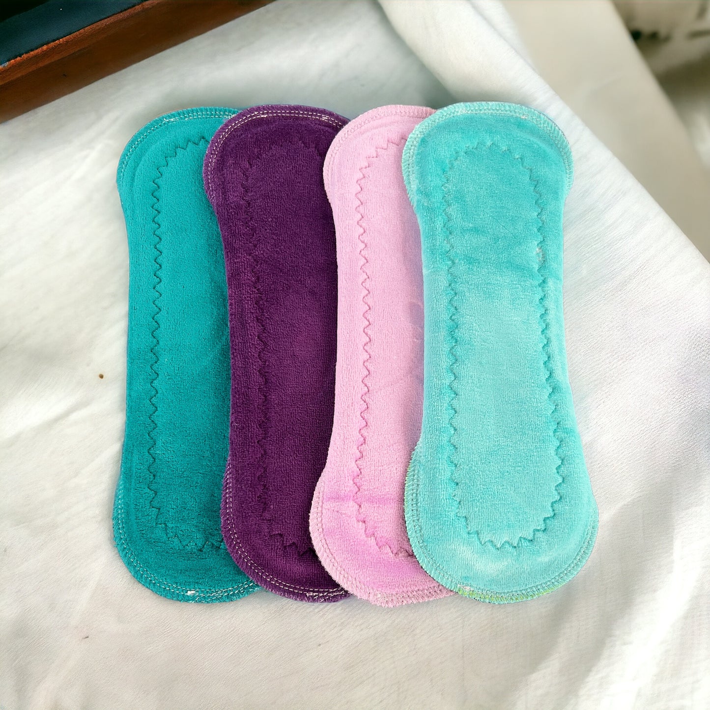 Paquete 4 toallas flujo regular 26cms aqua mora algodón